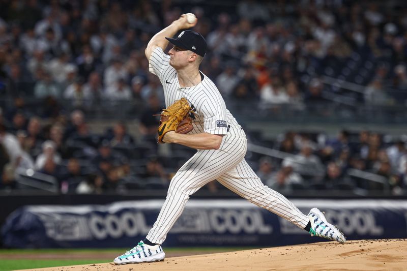 Sep 24, 2024; Bronx, New York, USA; New York Yankees starting pitcher Clarke Schmidt (36) delivers a pitch during the first inning against the Baltimore Orioles at Yankee Stadium. Mandatory Credit: Vincent Carchietta-Imagn Images