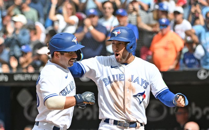 Aug 27, 2023; Toronto, Ontario, CAN;  Toronto Blue Jays second baseman Davis Schneider (36) is greeted by right fielder George Springer (4) after hitting a two-run home run against the Cleveland Guardians in the seventh inning at Rogers Centre. Mandatory Credit: Dan Hamilton-USA TODAY Sports