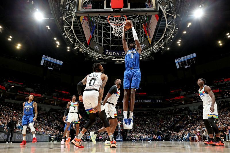 MINNEAPOLIS, MN -  FEBRUARY 3: Mo Bamba #11 of the Orlando Magic drives to the basket against the Minnesota Timberwolves on February 3, 2023 at Target Center in Minneapolis, Minnesota. NOTE TO USER: User expressly acknowledges and agrees that, by downloading and or using this Photograph, user is consenting to the terms and conditions of the Getty Images License Agreement. Mandatory Copyright Notice: Copyright 2023 NBAE (Photo by David Sherman/NBAE via Getty Images)