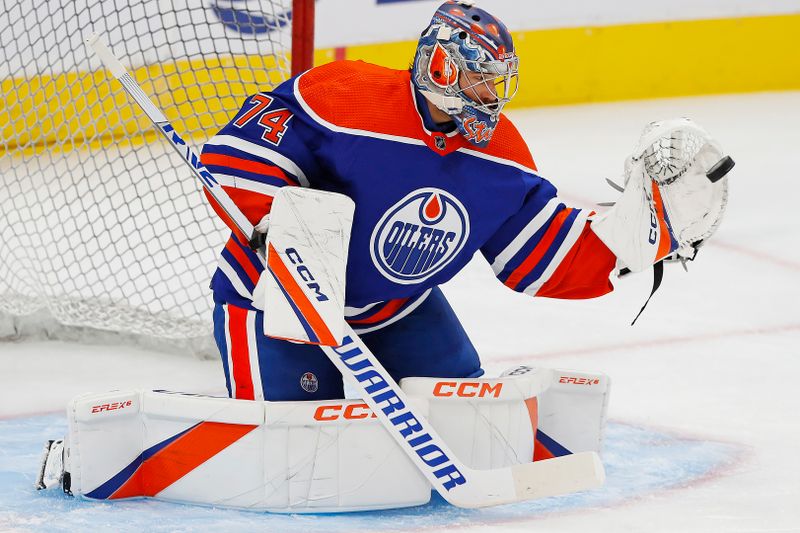 Sep 25, 2022; Edmonton, Alberta, CAN; Edmonton Oilers goaltender Stuart Skinner (74) makes a save during warmup against the Winnipeg Jets at Rogers Place. Mandatory Credit: Perry Nelson-USA TODAY Sports