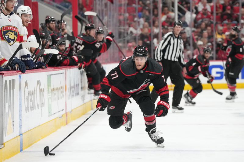 May 22, 2025; Raleigh, North Carolina, USA;  Carolina Hurricanes forward Mark Jankowski (77) skates with the puck during the third period against the Florida Panthers in game two of the Eastern Conference Final of the 2025 Stanley Cup Playoffs at Lenovo Center. Mandatory Credit: James Guillory-Imagn Images