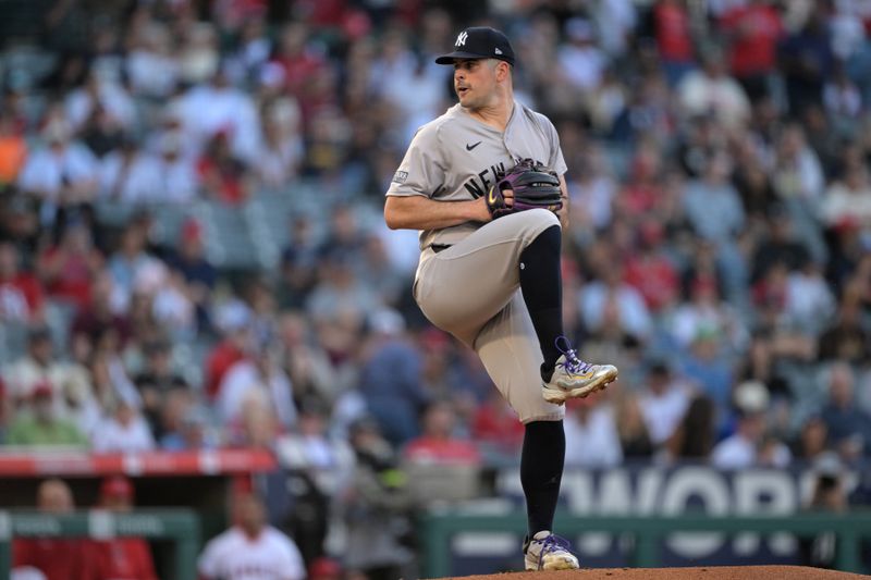 May 30, 2024; Anaheim, California, USA;  New York Yankees starting pitcher Carlos Rodon (55) delivers to the plate in the first inning against the Los Angeles Angels at Angel Stadium. Mandatory Credit: Jayne Kamin-Oncea-USA TODAY Sports