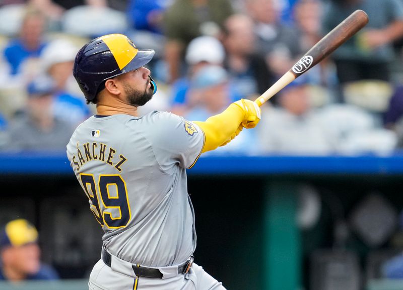 May 6, 2024; Kansas City, Missouri, USA; Milwaukee Brewers catcher Gary Sánchez (99) hits a home run during the fourth inning against the Kansas City Royals at Kauffman Stadium. Mandatory Credit: Jay Biggerstaff-USA TODAY Sports