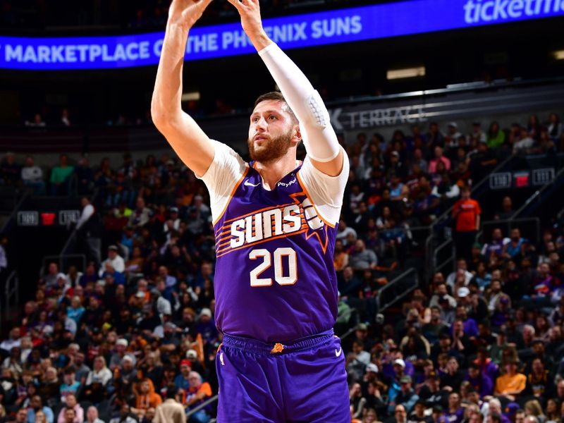 PHOENIX, AZ - NOVEMBER 6: Jusuf Nurkic #20 of the Phoenix Suns three point basket during the game against the Miami Heat on November 6, 2024 at Footprint Center in Phoenix, Arizona. NOTE TO USER: User expressly acknowledges and agrees that, by downloading and or using this photograph, user is consenting to the terms and conditions of the Getty Images License Agreement. Mandatory Copyright Notice: Copyright 2024 NBAE (Photo by Barry Gossage/NBAE via Getty Images)