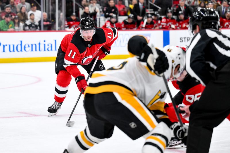 Nov 8, 2025; Newark, New Jersey, USA; New Jersey Devils right wing Stefan Noesen (11) looks on during a face-off against the Pittsburgh Penguins in the second period at Prudential Center. Mandatory Credit: John Jones-Imagn Images