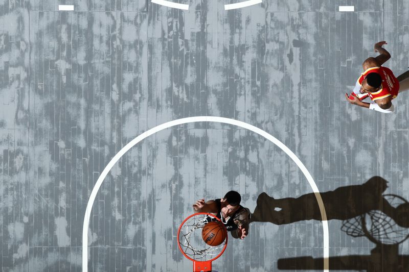 MEMPHIS, TN - MARCH 8: John Konchar #46 of the Memphis Grizzlies drives to the basket during the game against the Atlanta Hawks on March 8, 2024 at FedExForum in Memphis, Tennessee. NOTE TO USER: User expressly acknowledges and agrees that, by downloading and or using this photograph, User is consenting to the terms and conditions of the Getty Images License Agreement. Mandatory Copyright Notice: Copyright 2024 NBAE (Photo by Joe Murphy/NBAE via Getty Images)