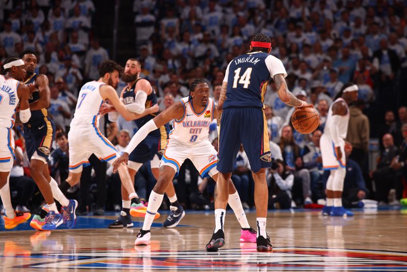 OKLAHOMA CITY, OK - APRIL 21:  Jalen Williams #8 of the Oklahoma City Thunder plays defense during the game  against Brandon Ingram #14 of the New Orleans Pelicans during Round 1 Game 1 of the 2024 NBA Playoffs on April 21, 2024 at Paycom Arena in Oklahoma City, Oklahoma. NOTE TO USER: User expressly acknowledges and agrees that, by downloading and or using this photograph, User is consenting to the terms and conditions of the Getty Images License Agreement. Mandatory Copyright Notice: Copyright 2024 NBAE (Photo by Zach Beeker/NBAE via Getty Images)