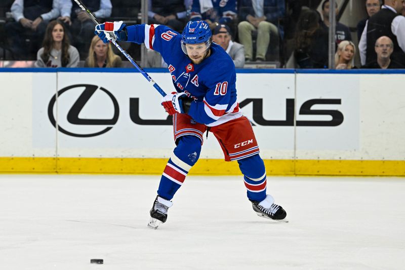 May 30, 2024; New York, New York, USA; New York Rangers left wing Artemi Panarin (10) lines up a shot against the Florida Panthers during the first period in game five of the Eastern Conference Final of the 2024 Stanley Cup Playoffs at Madison Square Garden. Mandatory Credit: Dennis Schneidler-USA TODAY Sports