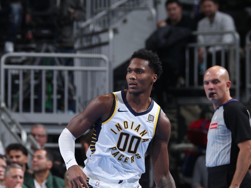 MILWAUKEE, WI - NOVEMBER 22:  Bennedict Mathurin #00 of the Indiana Pacers dribbles the ball during the game against the Milwaukee Bucks during a Emirates NBA Cup on November 22, 2024 at Fiserv Forum Center in Milwaukee, Wisconsin. NOTE TO USER: User expressly acknowledges and agrees that, by downloading and or using this Photograph, user is consenting to the terms and conditions of the Getty Images License Agreement. Mandatory Copyright Notice: Copyright 2024 NBAE (Photo by Gary Dineen/NBAE via Getty Images).