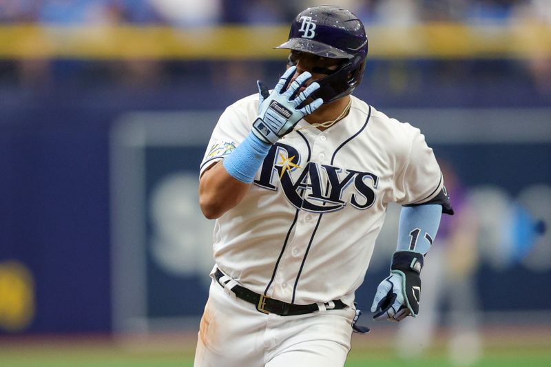 Aug 24, 2023; St. Petersburg, Florida, USA;  Tampa Bay Rays third baseman Isaac Paredes (17) runs the bases after hitting a solo home run against the Colorado Rockies in the sixth inning at Tropicana Field. Mandatory Credit: Nathan Ray Seebeck-USA TODAY Sports