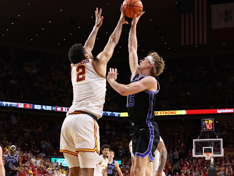 Mar 4, 2025; Ames, Iowa, USA; Iowa State Cyclones forward Joshua Jefferson (2) blocks the shot from Brigham Young Cougars forward Richie Saunders (15) during the second half at James H. Hilton Coliseum. Mandatory Credit: Reese Strickland-Imagn Images