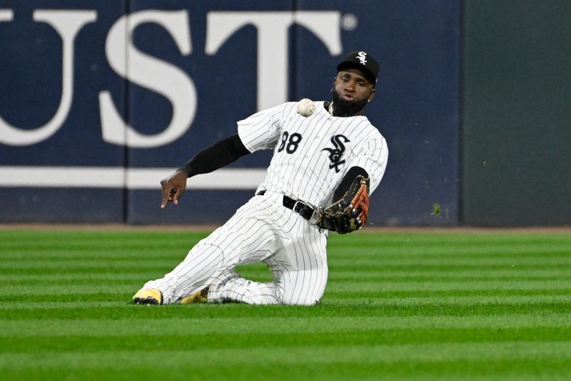 Sep 13, 2024; Chicago, Illinois, USA;  Chicago White Sox outfielder Luis Robert Jr. (88) catches a fly ball hit by Oakland Athletics outfielder Seth Brown (15) during the sixth inning at Guaranteed Rate Field. Mandatory Credit: Matt Marton-Imagn Images