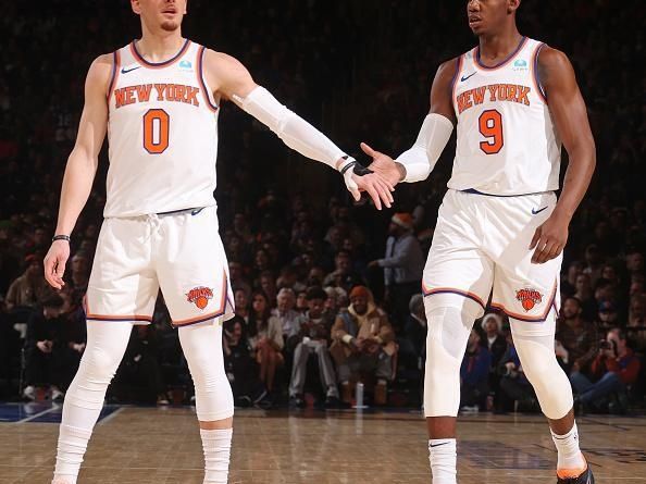 NEW YORK, NY - DECEMBER 25: RJ Barrett #9 and Donte Divincenzo #0 of the New York Knicks high five during the game against the Milwaukee Bucks on December 25, 2023 at Madison Square Garden in New York City, New York.  NOTE TO USER: User expressly acknowledges and agrees that, by downloading and or using this photograph, User is consenting to the terms and conditions of the Getty Images License Agreement. Mandatory Copyright Notice: Copyright 2023 NBAE  (Photo by Nathaniel S. Butler/NBAE via Getty Images)