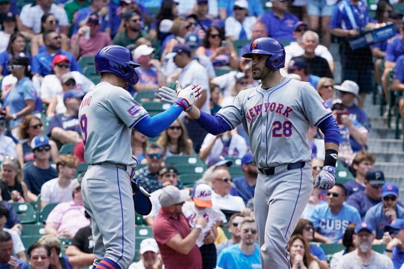 Jun 21, 2024; Chicago, Illinois, USA; New York Mets designated hitter J.D. Martinez (28) is greeted by  outfielder Brandon Nimmo (9) after hitting a three-run home run against the Chicago Cubs during the first inning at Wrigley Field. Mandatory Credit: David Banks-USA TODAY Sports