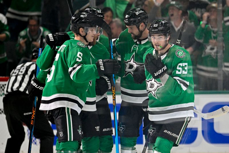 May 7, 2024; Dallas, Texas, USA; Dallas Stars defenseman Nils Lundkvist (5) and left wing Jamie Benn (14) and center Wyatt Johnston (53) celebrates a goal scored by Johnston against the Colorado Avalanche during the first period in game one of the second round of the 2024 Stanley Cup Playoffs at American Airlines Center. Mandatory Credit: Jerome Miron-USA TODAY Sports