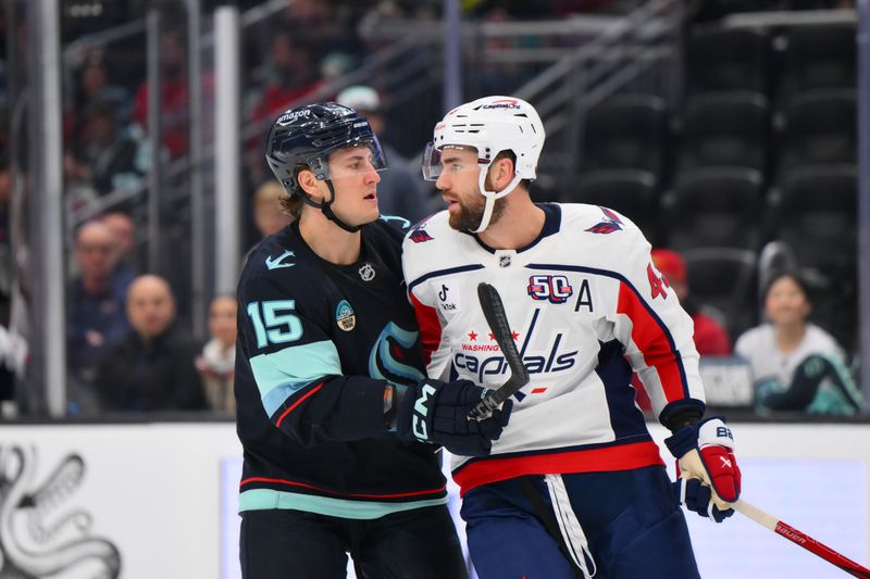 Jan 23, 2025; Seattle, Washington, USA; Seattle Kraken center John Hayden (15) and Washington Capitals right wing Tom Wilson (43) exchange words during the third period at Climate Pledge Arena. Mandatory Credit: Steven Bisig-Imagn Images