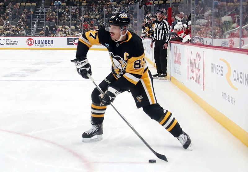 Nov 30, 2024; Pittsburgh, Pennsylvania, USA;  Pittsburgh Penguins center Sidney Crosby (87) shoots the puck against the Calgary Flames during the first period at PPG Paints Arena. Mandatory Credit: Charles LeClaire-Imagn Images