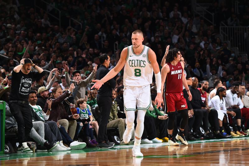 BOSTON, MA - APRIL 21: Kristaps Porzingis #8 of the Boston Celtics celebrates during the game against the Miami Heat during Round 1 Game 1 of the 2024 NBA Playoffs on April 21, 2024 at the TD Garden in Boston, Massachusetts. NOTE TO USER: User expressly acknowledges and agrees that, by downloading and or using this photograph, User is consenting to the terms and conditions of the Getty Images License Agreement. Mandatory Copyright Notice: Copyright 2024 NBAE  (Photo by Brian Babineau/NBAE via Getty Images)