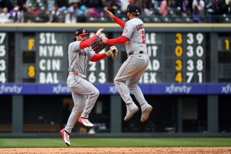 Apr 19, 2025; Denver, Colorado, USA; Washington Nationals outfielder Dylan Crews (3) and second base Luis García Jr. (2) celebrate after a win against the Colorado Rockies at Coors Field. Mandatory Credit: Christopher Hanewinckel-Imagn Images