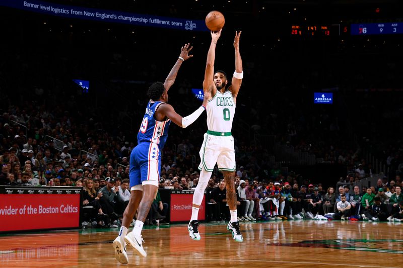 BOSTON, MA - OCTOBER 12: Jayson Tatum #0 of the Boston Celtics shoots a three point basket during the game against the Philadelphia 76ers during a NBA Preseason game on October 12, 2024 at TD Garden in Boston, Massachusetts. NOTE TO USER: User expressly acknowledges and agrees that, by downloading and/or using this Photograph, user is consenting to the terms and conditions of the Getty Images License Agreement. Mandatory Copyright Notice: Copyright 2024 NBAE (Photo by Brian Babineau/NBAE via Getty Images)