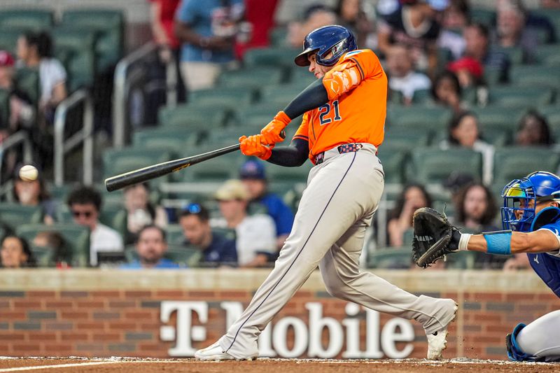 Sep 13, 2025; Cumberland, Georgia, USA; Houston Astros catcher Yainer Diaz (21) singles to drive in a run against the Atlanta Braves during the second inning at Truist Park. Mandatory Credit: Dale Zanine-Imagn Images