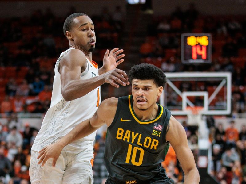 Jan 6, 2024; Stillwater, Oklahoma, USA; Baylor Bears guard RayJ Dennis (10) drives past Oklahoma State Cowboys guard Bryce Thompson (1) during the second half at Gallagher-Iba Arena. Mandatory Credit: William Purnell-USA TODAY Sports