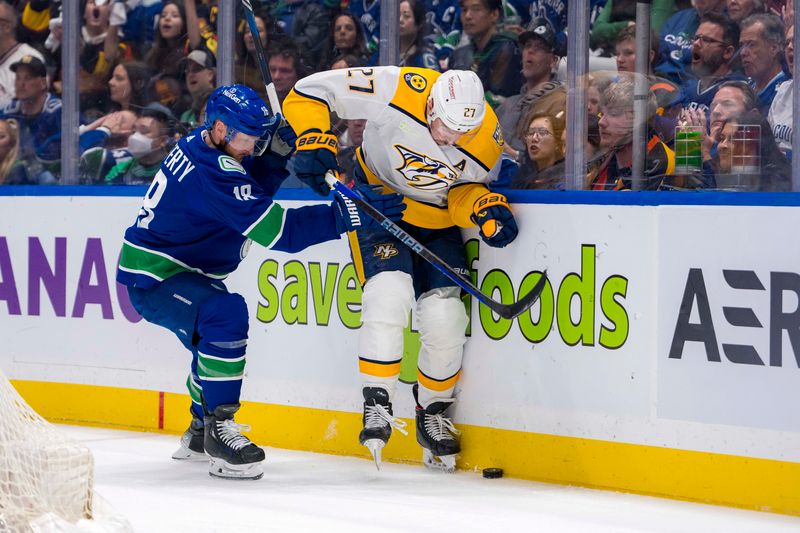 Apr 21, 2024; Vancouver, British Columbia, CAN; Vancouver Canucks forward Sam Lafferty (18) checks Nashville Predators defenseman Ryan McDonagh (27) in the third period in game one of the first round of the 2024 Stanley Cup Playoffs at Rogers Arena. Mandatory Credit: Bob Frid-USA TODAY Sports