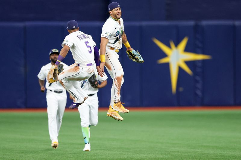 May 26, 2023; St. Petersburg, Florida, USA;  Tampa Bay Rays center fielder Jose Siri (22) and shortstop Wander Franco (5) celebrate after beating the Los Angeles Dodgers at Tropicana Field. Mandatory Credit: Nathan Ray Seebeck-USA TODAY Sports