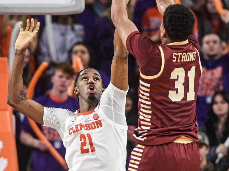 Jan 13, 2024; Clemson, South Carolina, USA; Boston College Eagles forward Elijah Strong (31) shoots the ball against Clemson Tigers  forward Chauncey Wiggins (21) during the second half at Littlejohn Coliseum. Mandatory Credit: Ken Ruinard-USA TODAY Sports