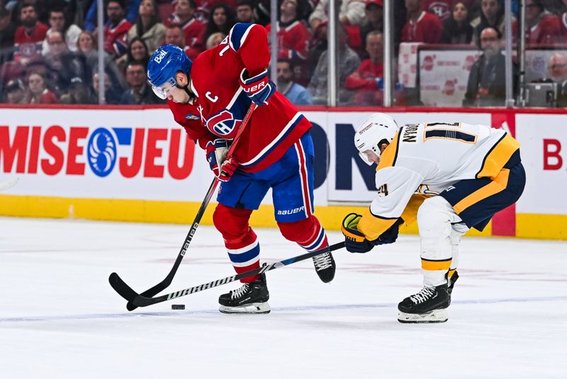 Dec 10, 2023; Montreal, Quebec, CAN; Nashville Predators center Gustav Nyquist (14) defends the puck against Montreal Canadiens center Nick Suzuki (14) during the third period at Bell Centre. Mandatory Credit: David Kirouac-USA TODAY Sports