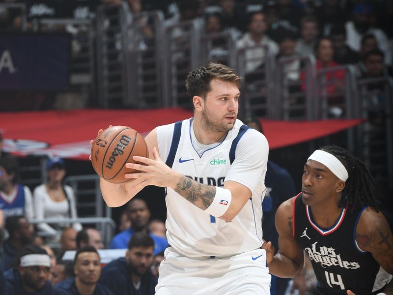 LOS ANGELES, CA - APRIL 23: Luka Doncic #77 of the Dallas Mavericks handles the ball during the game against the LA Clippers during Round 1 Game 2 of the 2024 NBA Playoffs on April 23, 2024 at Crypto.Com Arena in Los Angeles, California. NOTE TO USER: User expressly acknowledges and agrees that, by downloading and/or using this Photograph, user is consenting to the terms and conditions of the Getty Images License Agreement. Mandatory Copyright Notice: Copyright 2024 NBAE (Photo by Andrew D. Bernstein/NBAE via Getty Images)