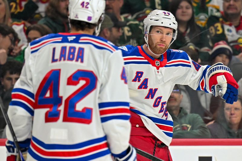 Mar 14, 2026; Saint Paul, Minnesota, USA;  New York Rangers defensemen Vladislav Gavrikov (44) celebrates his goal against the Minnesota Wild with forward Noah Laba (42) during the first period at Grand Casino Arena. Mandatory Credit: Nick Wosika-Imagn Images