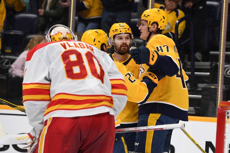 Jan 4, 2024; Nashville, Tennessee, USA; Nashville Predators right wing Michael McCarron (47) celebrates after a goal against Calgary Flames goaltender Dan Vladar (80) during the third period at Bridgestone Arena. Mandatory Credit: Christopher Hanewinckel-USA TODAY Sports