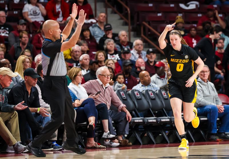 Feb 8, 2024; Columbia, South Carolina, USA; Missouri Tigers guard Grace Slaughter (0) celebrates a three point basket against the Missouri Tigers in the first half at Colonial Life Arena. Mandatory Credit: Jeff Blake-USA TODAY Sports