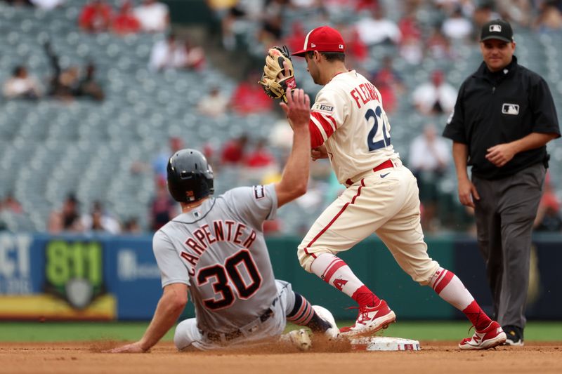 Sep 17, 2023; Anaheim, California, USA; Los Angeles Angels shortstop David Fletcher (22) forces Detroit Tigers right fielder Kerry Carpenter (30) out at second base during the fifth inning at Angel Stadium. Mandatory Credit: Kiyoshi Mio-USA TODAY Sports