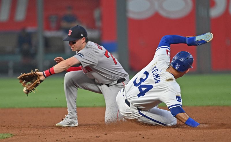 Aug 5, 2024; Kansas City, Missouri, USA;  Kansas City Royals designated hitter Freddy Fermin (34) steals second base against Boston Red Sox second baseman Nick Sogard (75) in the fourth inning at Kauffman Stadium. Mandatory Credit: Peter Aiken-USA TODAY Sports