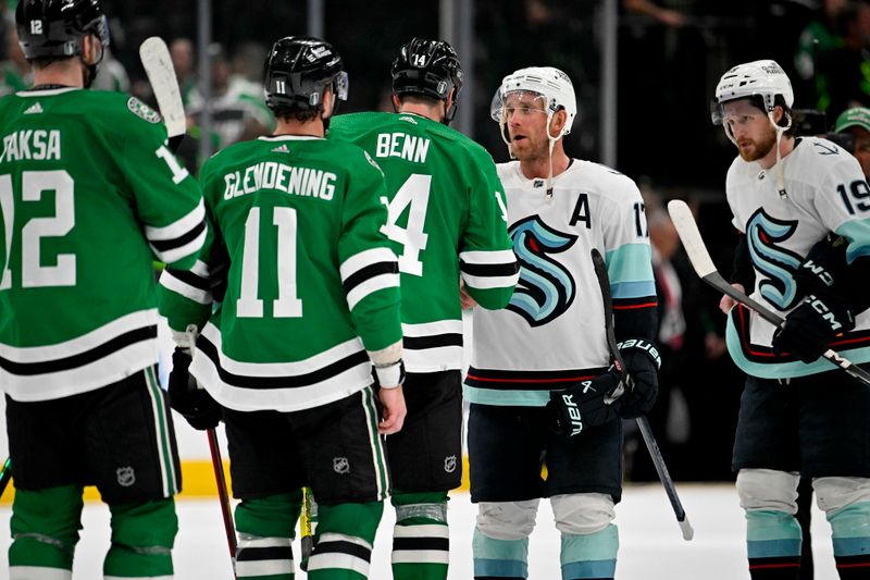 May 15, 2023; Dallas, Texas, USA; Dallas Stars left wing Jamie Benn (14) shakes hands with Seattle Kraken center Jaden Schwartz (17) celebrate after the Stars defeat the Seattle Kraken in game seven of the second round of the 2023 Stanley Cup Playoffs at the American Airlines Center. Mandatory Credit: Jerome Miron-USA TODAY Sports