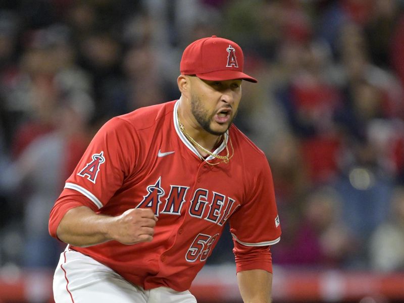 Apr 6, 2024; Anaheim, California, USA; Los Angeles Angels pitcher Carlos Estevez (53) celebrates after the final out of the ninth inning and a save against the Boston Red Sox at Angel Stadium. Mandatory Credit: Jayne Kamin-Oncea-USA TODAY Sports