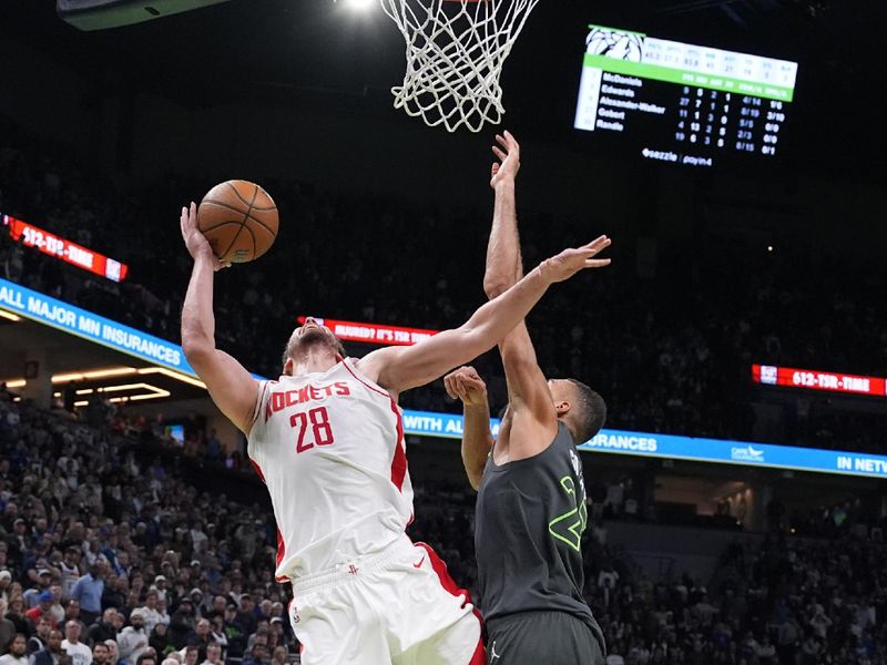 MINNEAPOLIS, MN -  NOVEMBER 26: Alperen Sengun #28 of the Houston Rockets drives to the basket during the game against the Minnesota Timberwolves during the Emirates NBA Cup game on November 26, 2024 at Target Center in Minneapolis, Minnesota. NOTE TO USER: User expressly acknowledges and agrees that, by downloading and or using this Photograph, user is consenting to the terms and conditions of the Getty Images License Agreement. Mandatory Copyright Notice: Copyright 2024 NBAE (Photo by Jordan Johnson/NBAE via Getty Images)