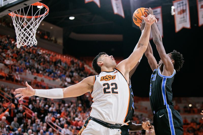 Feb 4, 2026; Stillwater, Oklahoma, USA; BYU Cougars forward AJ Dybantsa (3) and Oklahoma State Cowboys forward Parsa Fallah (22) rebound during the first half at Gallagher-Iba Arena. Mandatory Credit: William Purnell-Imagn Images