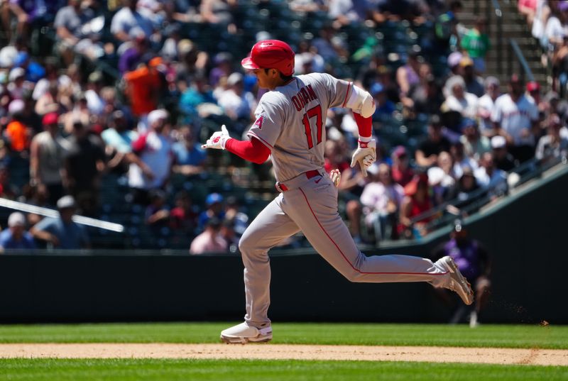 Jun 25, 2023; Denver, Colorado, USA; Los Angeles Angels starting pitcher Shohei Ohtani (17) runs out a triple in the sixth inning at Coors Field. Mandatory Credit: Ron Chenoy-USA TODAY Sports