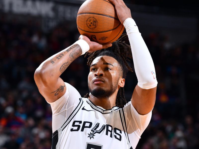 PHOENIX, AZ - DECEMBER 3: Stephon Castle #5 of the San Antonio Spurs shoots a free throw during the game against the Phoenix Suns during a Emirates NBA Cup game on December 3, 2024 at Footprint Center in Phoenix, Arizona. NOTE TO USER: User expressly acknowledges and agrees that, by downloading and or using this photograph, user is consenting to the terms and conditions of the Getty Images License Agreement. Mandatory Copyright Notice: Copyright 2024 NBAE (Photo by Barry Gossage/NBAE via Getty Images)