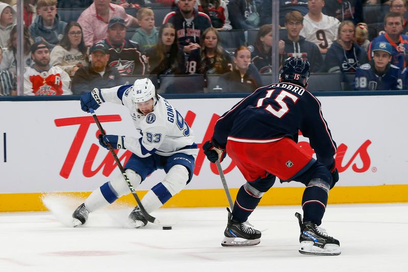 Oct 18, 2025; Columbus, Ohio, USA; Tampa Bay Lightning center Gage Goncalves (93) controls the puck defended by Columbus Blue Jackets defenseman Dante Fabbro (15) during the first period at Nationwide Arena. Mandatory Credit: Russell LaBounty-Imagn Images