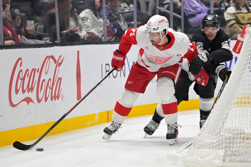 Nov 16, 2024; Los Angeles, California, USA; Detroit Red Wings center Dylan Larkin (71) is chased down by Los Angeles Kings left wing Kevin Fiala (22) in the first period at Crypto.com Arena. Mandatory Credit: Jayne Kamin-Oncea-Imagn Images