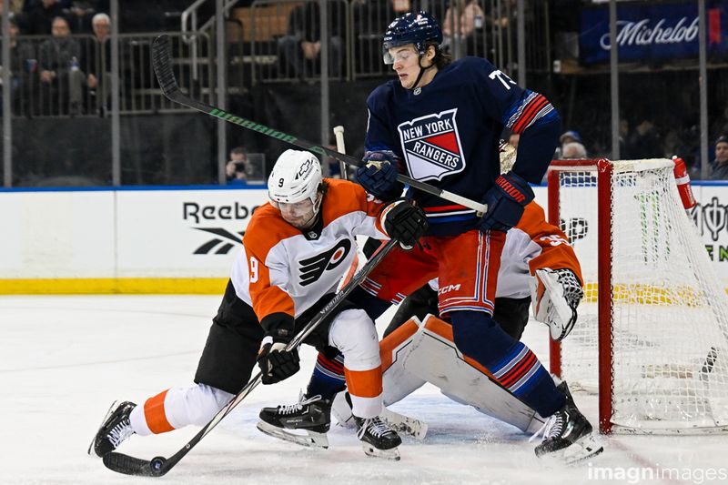 Apr 9, 2025; New York, New York, USA;  Philadelphia Flyers defenseman Jamie Drysdale (9) blocks a shot in front of New York Rangers center Matt Rempe (73) during the second period at Madison Square Garden. Mandatory Credit: Dennis Schneidler-Imagn Images