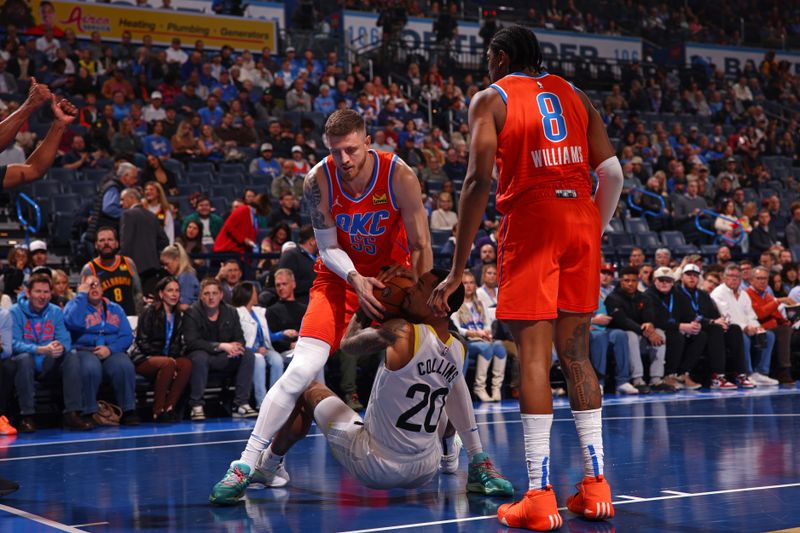 OKLAHOMA CITY, OK - DECEMBER 3: Isaiah Hartenstein #55 of the Oklahoma City Thunder and John Collins #20 of the Utah Jazz battle for jump ball during the Emirates NBA Cup game on on December 3, 2024 at Paycom Center in Oklahoma City, Oklahoma. NOTE TO USER: User expressly acknowledges and agrees that, by downloading and or using this photograph, User is consenting to the terms and conditions of the Getty Images License Agreement. Mandatory Copyright Notice: Copyright 2024 NBAE (Photo by Zach Beeker/NBAE via Getty Images)