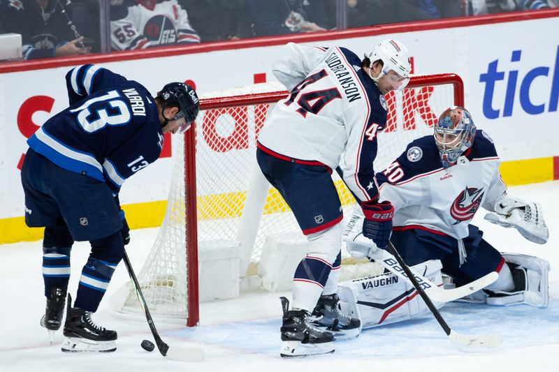 Jan 9, 2024; Winnipeg, Manitoba, CAN; Winnipeg Jets forward Gabriel Vilardi (13) shoots the puck to score a goal against Columbus Blue Jackets goalie Daniil Tarasov (40) during the third period at Canada Life Centre. Mandatory Credit: Terrence Lee-USA TODAY Sports