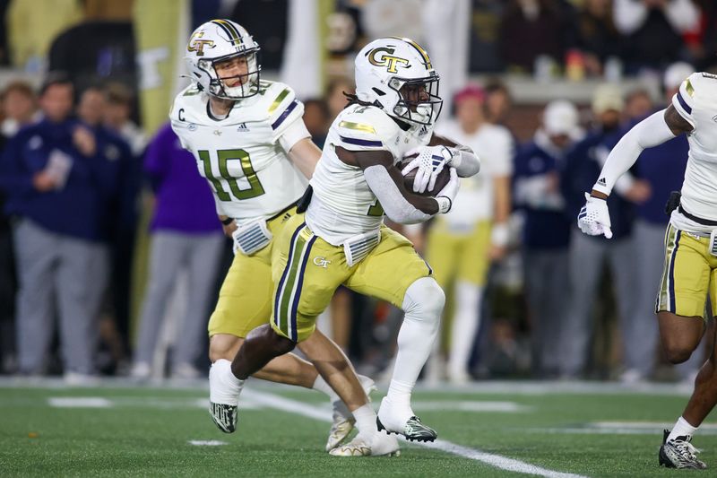 Nov 25, 2023; Atlanta, Georgia, USA; Georgia Tech Yellow Jackets running back Jamal Haynes (11) runs the ball against the Georgia Bulldogs in the first quarter at Bobby Dodd Stadium at Hyundai Field. Mandatory Credit: Brett Davis-USA TODAY Sports