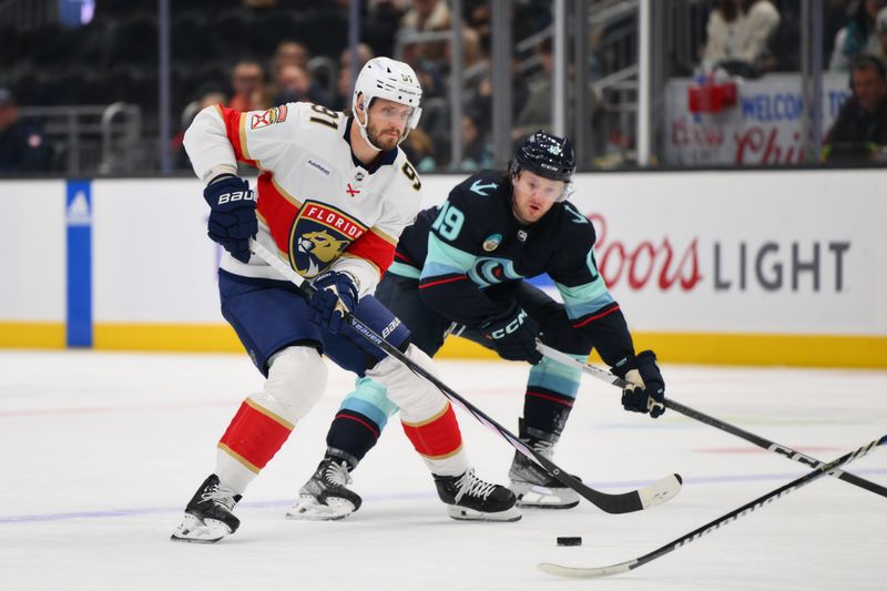 Dec 12, 2023; Seattle, Washington, USA; Florida Panthers defenseman Oliver Ekman-Larsson (91) pays the puck against the Seattle Kraken during the first period at Climate Pledge Arena. Mandatory Credit: Steven Bisig-USA TODAY Sports.