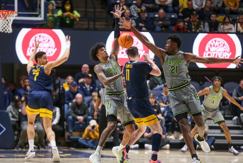 Feb 17, 2024; Morgantown, West Virginia, USA; Baylor Bears center Yves Missi (21) and Baylor Bears forward Jalen Bridges (11) defend against West Virginia Mountaineers forward Quinn Slazinski (11) during the first half at WVU Coliseum. Mandatory Credit: Ben Queen-USA TODAY Sports